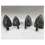 Four cast iron flat irons