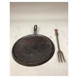 Cast iron griddle and fork