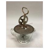 Antique egg beater and measuring cup
