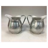 Two aluminum water pitchers
