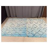 Two Blue Geometric Rugs