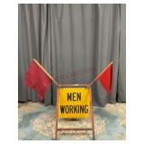 Men Working Road Sign with Caution Flags