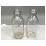Two Antique H.B. Servey & Sons Milk Bottles