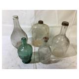 Glass Bottles with Grapes on Them