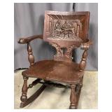 George Arndt Style Relief Carved Rocking Chair