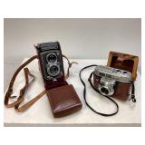 Two Vintage Cameras in Leather Cases