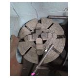 4-jaw lathe chuck used for workholding in metalworking.