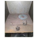 Shelf of black pipe fittings