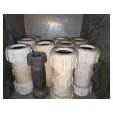 Shelf of black pipe fittings.