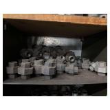 Cubby of black pipe fittings