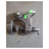 is a Merrill lifting plate clamp (or a similar style of industrial plate dog clamp) used for securely gripping and lifting heavy metal plates.