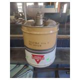 lot contains a vintage metal container, specifically a collectible 5-gallon oil can branded by Conoco.