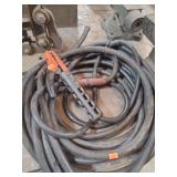 heavy-duty insulated electrical cable, which is commonly used for industrial or automotive applications such as welding leads or jumper cables.