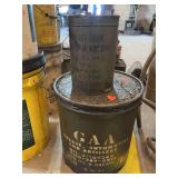 Two military grease cans.