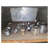 Shelf of black/ galvanized pipe fittings