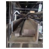 contents of shelf.  several pieces of steel, angled, solid square.  lengths range from rements to 10 feet.