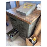 military-style industrial workbench featuring a heavy-duty steel cabinet base with numerous drawers and a thick wooden top