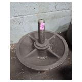 iron wheel, potentially from an industrial tram car or a similar historical machinery application.