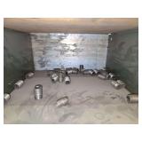 Shelf of black/ galvanized pipe fittings