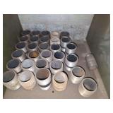 Shelf of black/ galvanized pipe fittings