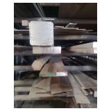 contents of shelf.  several pieces of solid round and square steel, round galvanized pipe.  steel and pipe range in length from 4 to 15 feet.