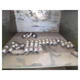 Shelf of black/ galvanized pipe fittings