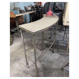 curved stainless steel table