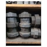 Shelf of black/galvanized pipe fittings
