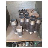 Shelf of black/ galvanized pipe fittings