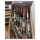 Box of assorted expandable reaming bits.