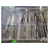 lot contains a plastic case with several different sized metalworking hand taps.