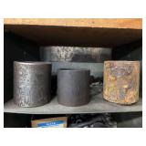 Cubby of black pipe fittings