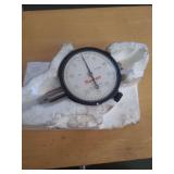 lot contains a Starrett dial indicator, a precision measuring instrument used in machining and manufacturing to measure small linear distances or deviations.