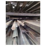 contents of shelf.  several pieces of solid square steel, twisted solid steel, hexagon shaped solid steel,  solid round steel, and rebar..lengths range from rements to 20 foot