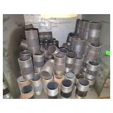 Shelf of black/ galvanized pipe fittings