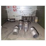 Shelf of black/ galvanized pipe fittings