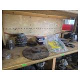 Shelf of misc sized black sprockets