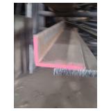 contents of shelf. several pieces of steel, angled, solid round and square. 1 I-beam. lengths range from 4 to 15 feet.