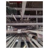 contents of shelf.  several pieces of angled aluminum,  round galvanized pipe, and square steel ranging in size from 5ft to 2