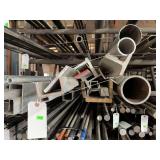 Contents of shelf. Several pieces of aluminum and steel ranging from small remnants to 20’ sticks. Angle, square tubing, flat strap, solid round and square,etc.