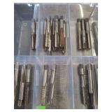 lot contains a plastic case with different sized threading taps