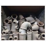 Shelf of black/ galvanized pipe fittings