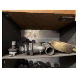 Cubby of black pipe fittings