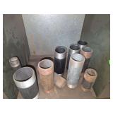 Shelf of black/ galvanized pipe fittings