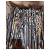 1 lot containing several straight and taper shank carbon steel drill bits.