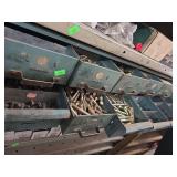 Nuts and bolts and spacers in an organizer.