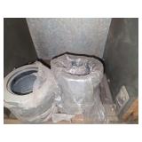 Shelf of galvanized pipe fittings.