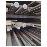 contents of shelf.  several pieces of different sized steel ranging from rements to 20 foot lengths. pieces include solid square steel stock,hexagon solid steel stock, round pipe, flat steel stock.