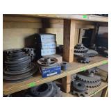 Shelf of misc sized black sprockets