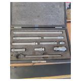 lot contains a tubular inside micrometer set, which is a precision measuring tool used by machinists and engineers to measure the internal diameter of holes, cylinders, and other objects.